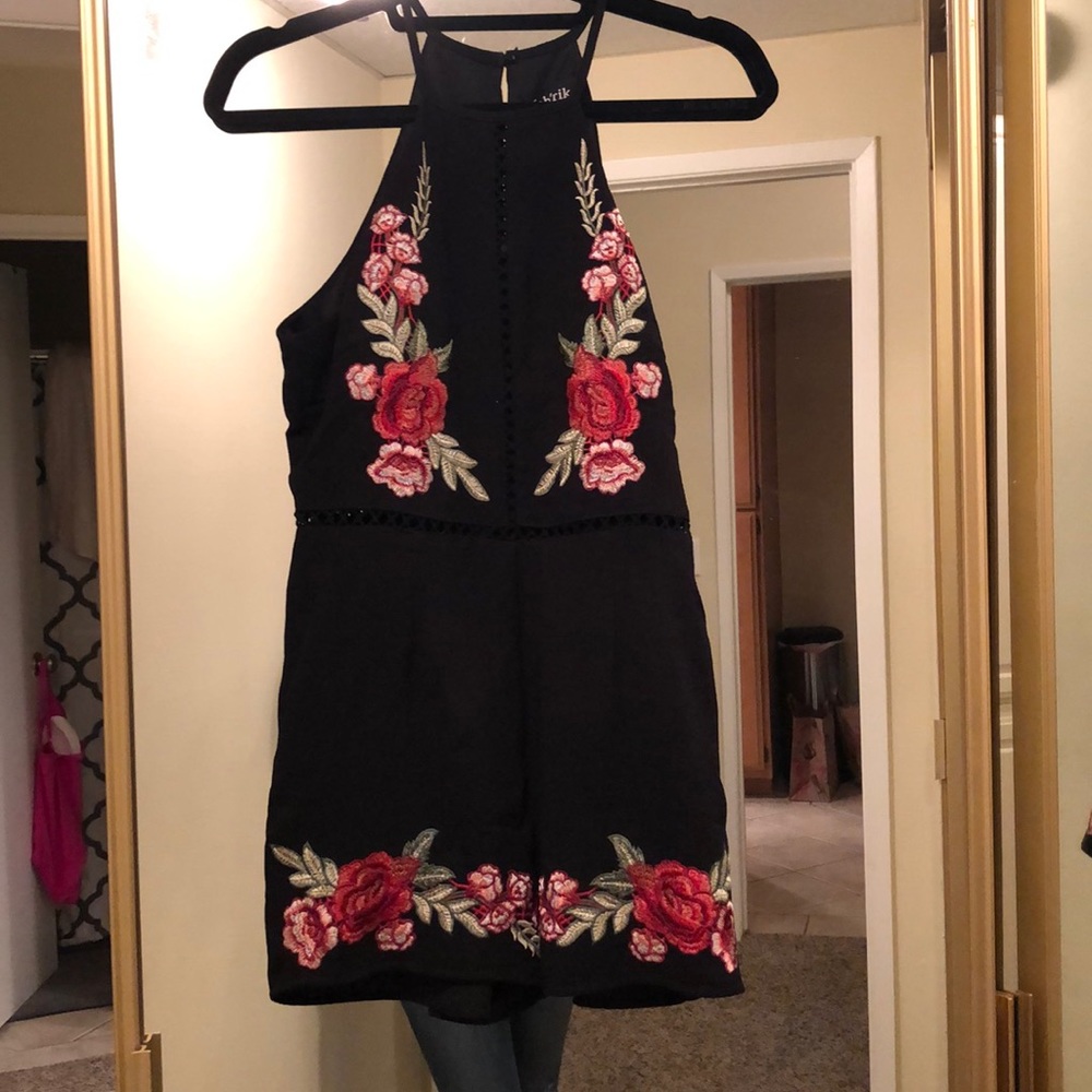 Black romper with rose detail